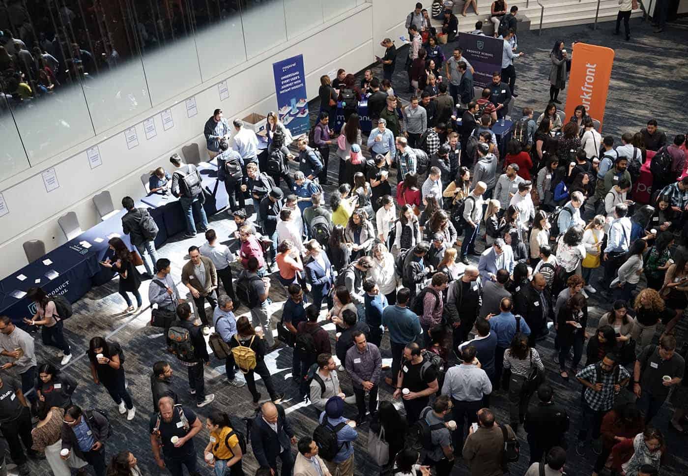 large crowd of people networking at trade shows on the event floor