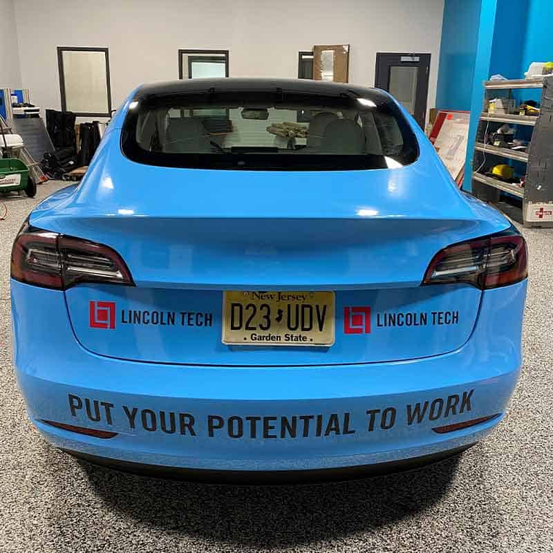 Lincoln Tech branded car graphic with call to action made by Strategic Factory.