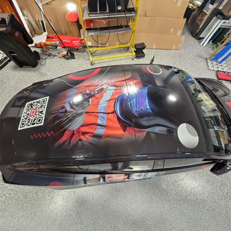 Creative vehicle graphic with QR Code made by Strategic Factory.