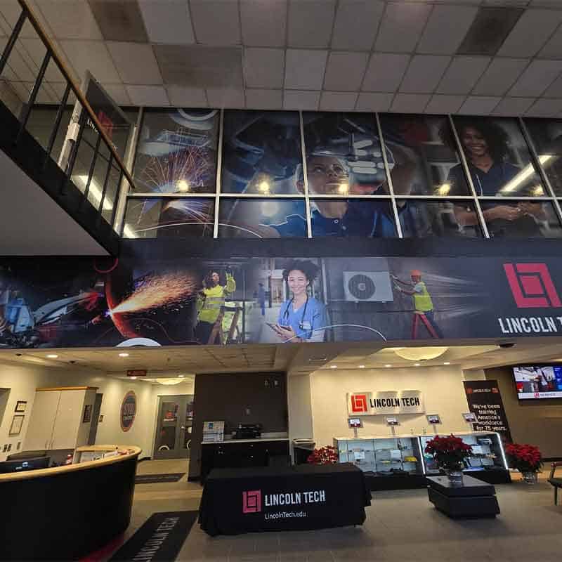 Branded lobby wall wrap at Lincoln Tech made by Strategic Factory.
