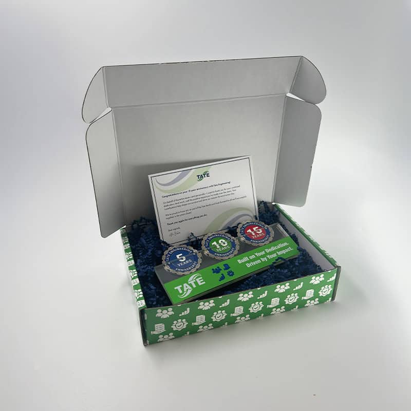 employee reward system of challenge coins delivered in a custom branded box made by strategic factory