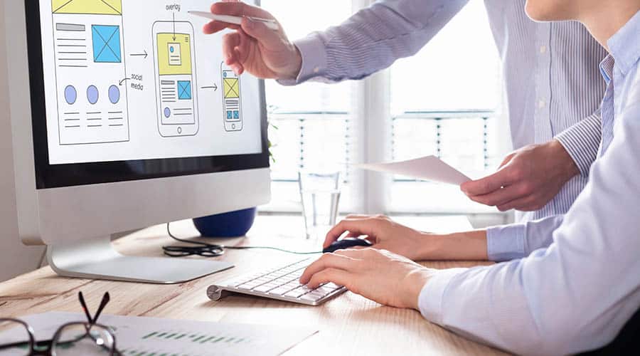 marketing team working on the computer to design