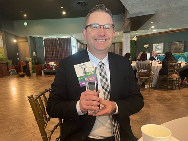 Robert Cardoni, Business Development Direct for Strategic Factory, accepts Ambassador of the Year Award from the Howard County Chamber of Commerce.