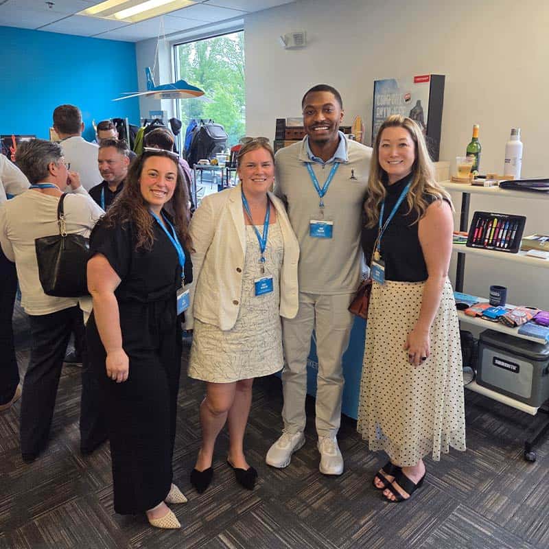 Guests pose at Strategic Factory's Sip and Connect event.