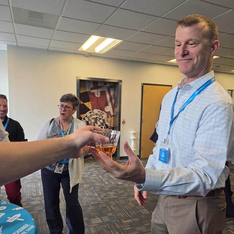 Guest enjoying bourbon tasting at Strategic Factory.