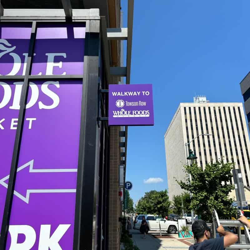 Greenberg Gibbons blade sign for Towson Row and Wholefoods shopping