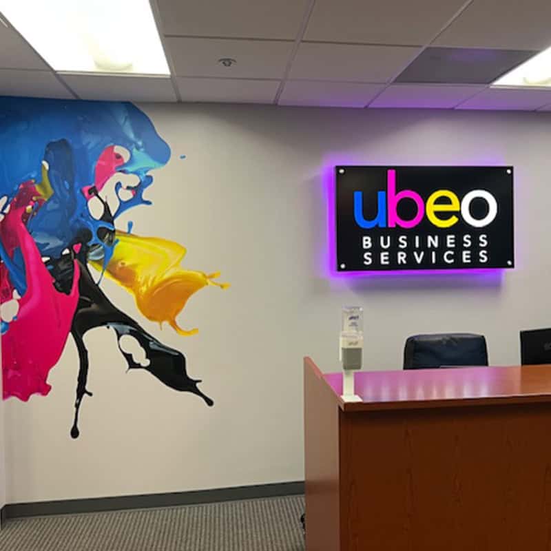 halo-lit front desk sign for UBEO Business services