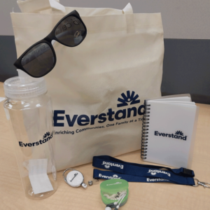employee appreciation kits with branded sunglasses, tote, water bottle, journal, lanyard, and badge clip